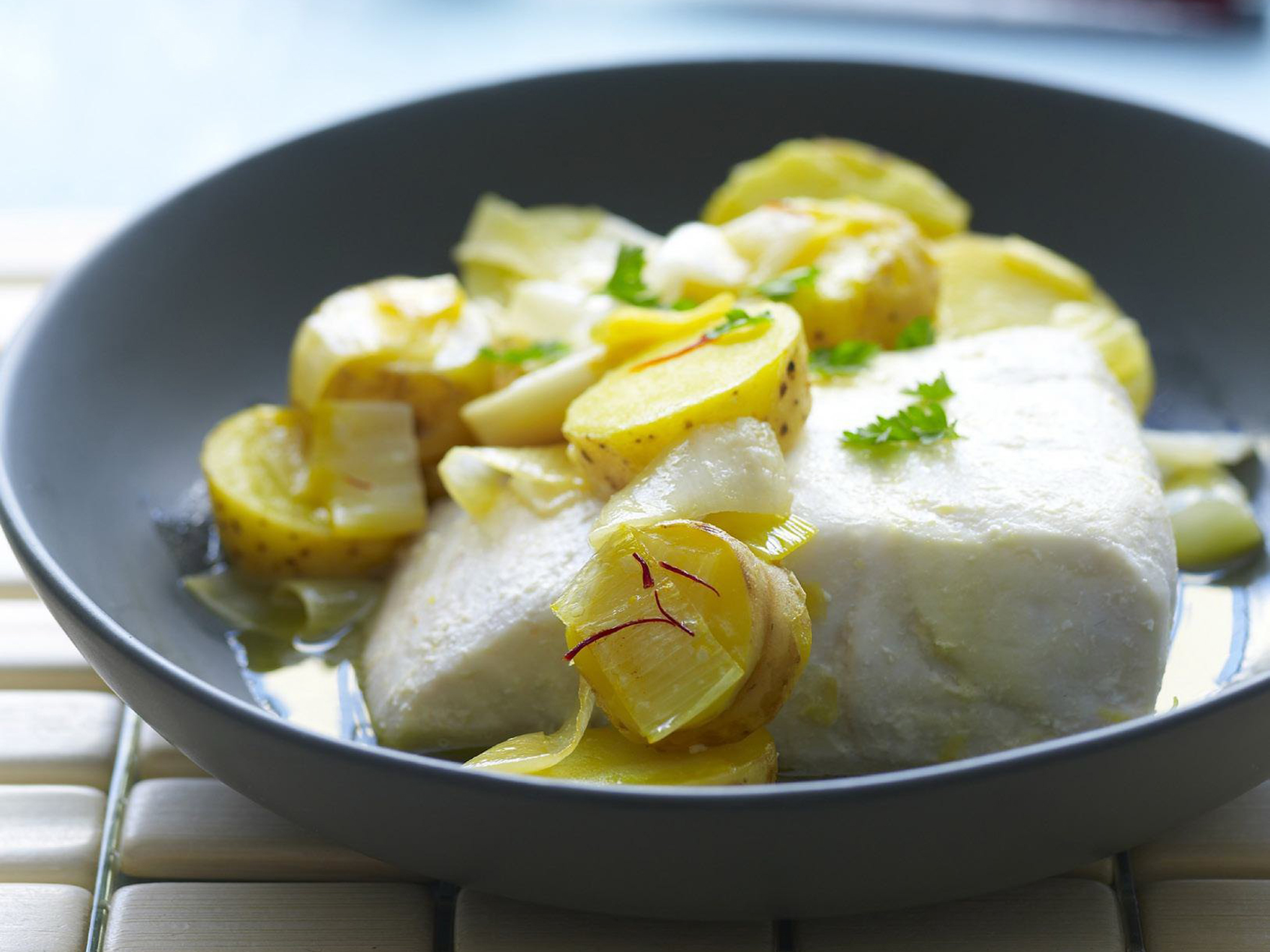 Baked fish with saffron, leek and potato