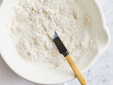 flour and sugar in a bowl to make scones